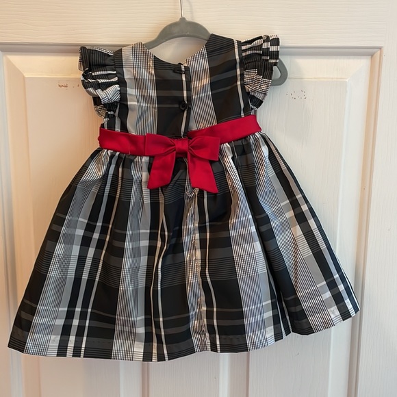 Beautiful black and white with a red sash dress - Picture 2 of 5